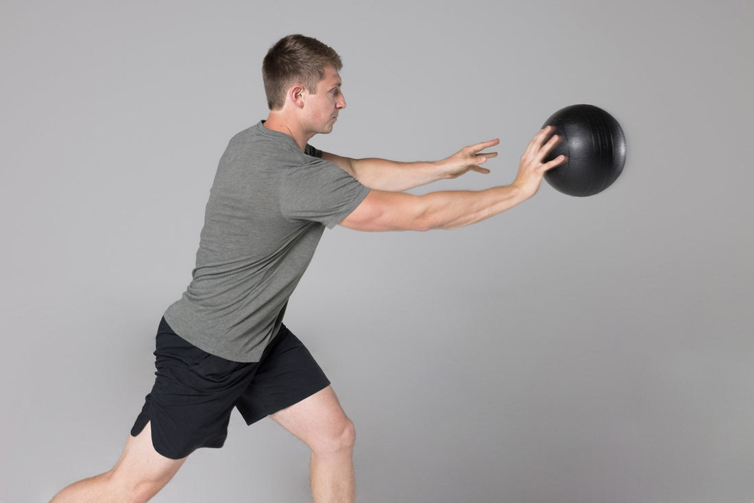 Athlete throws a REP® Slam Ball.