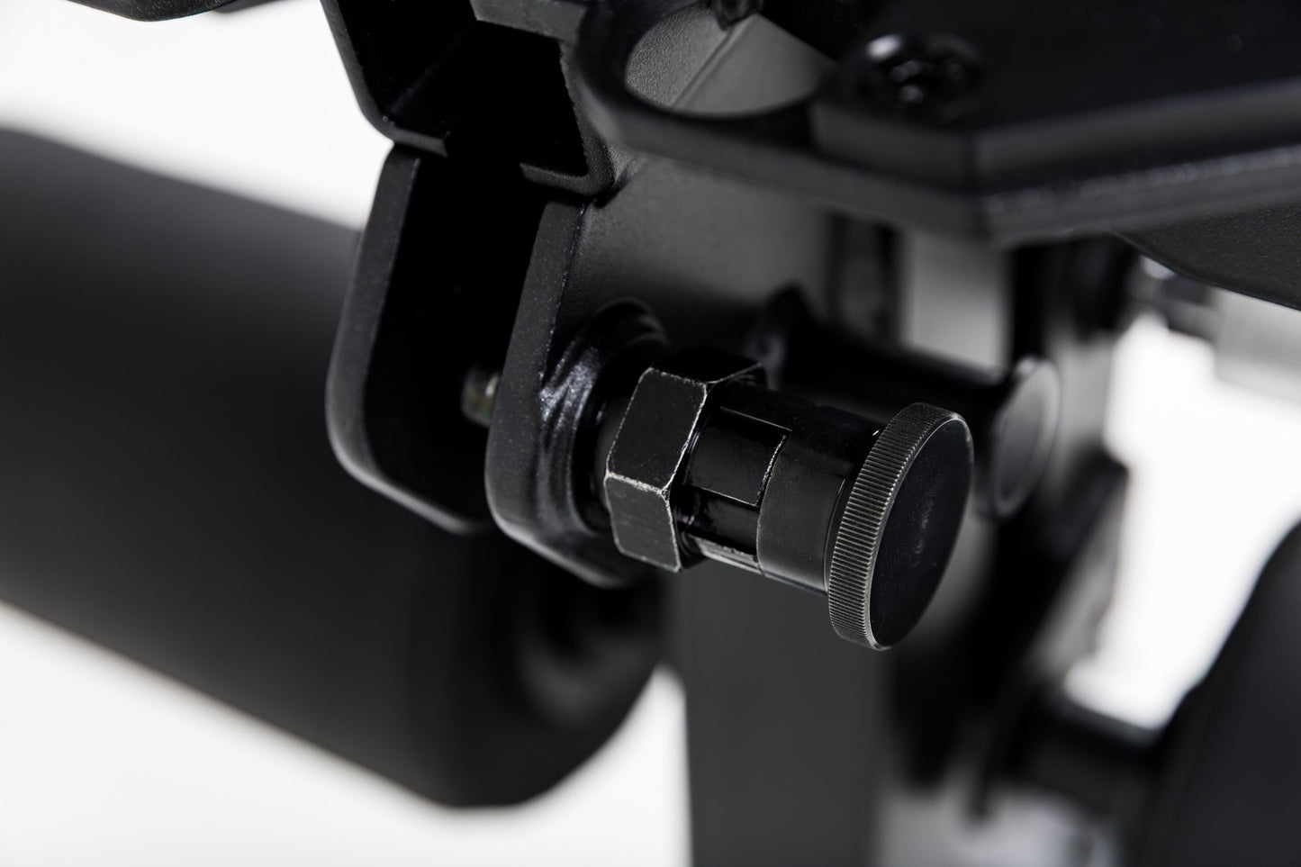 Close up of the lock-pin mechanism on the Leg Extension & Leg Curl Bench Attachment