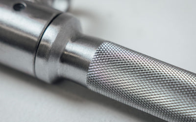 Close Up of Solid Lat Bar Knurling Texture from Rep Fitness UK | Shop Best Premium Gym Equipment for Home & Commercial Use Online